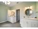 Bright bathroom with dual vanities, modern fixtures, and ample counter space for a luxurious feel at 1061 New Castle Ln, Oviedo, FL 32765