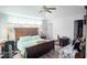 Bedroom featuring a ceiling fan, wood-look flooring, and neutral walls at 109 Grosvenor Loop, Davenport, FL 33897