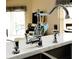 Close up of a kitchen sink featuring stainless steel hardware and fixtures at 109 Grosvenor Loop, Davenport, FL 33897