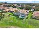 Aerial view of the home with screened-in pool, patio and lush green back yard at 11327 Ledgement Ln, Windermere, FL 34786