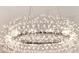 Close-up of a modern chandelier with intricate detailing and soft lighting at 11327 Ledgement Ln, Windermere, FL 34786