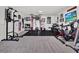 Spacious exercise room features carpet flooring, workout machines, and wall art at 11327 Ledgement Ln, Windermere, FL 34786