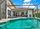 The screened-in pool and patio can be accessed from multiple points in the home at 11327 Ledgement Ln, Windermere, FL 34786