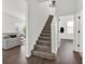 Carpeted staircase leading to the upper level, with hardwood floors on the first floor at 11327 Ledgement Ln, Windermere, FL 34786