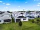 Aerial view of the backyard, featuring solar panels and a screened-in patio in a beautiful community at 11381 Satire St, Orlando, FL 32832