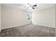 Bedroom featuring neutral carpet, paint, and a window providing natural light at 11381 Satire St, Orlando, FL 32832