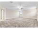 Large bedroom featuring carpeted floors, neutral paint, and abundant natural light at 11381 Satire St, Orlando, FL 32832