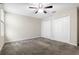 Bedroom showcasing carpeted floor, ceiling fan, closet and natural light at 11381 Satire St, Orlando, FL 32832