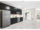 Modern kitchen with stainless steel appliances, subway tile backsplash and washer/dryer at 11381 Satire St, Orlando, FL 32832