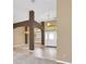 Inviting foyer with tile flooring, decorative columns, and a view of the front door and formal dining area at 1195 Legendary, Clermont, FL 34711