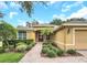 Inviting front entrance with a brick pathway and well-maintained landscaping leading to a red front door at 1195 Legendary, Clermont, FL 34711