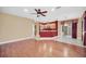 Spacious living room featuring hardwood floors and an open floor plan that leads into the kitchen at 1195 Legendary, Clermont, FL 34711