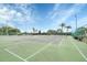 Community tennis courts surrounded by lush landscaping and decorative lights at 1195 Legendary, Clermont, FL 34711