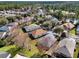 Aerial view of a residential community with lush trees and lakes at 123 Avenham Drive, Deland, FL 32724