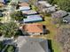 A high-angle shot reveals the home within a neighborhood, showcasing the roof and nearby lawns at 123 Avenham Drive, Deland, FL 32724