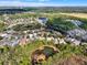 Aerial shot captures the community, highlighting the residential areas near natural ponds at 123 Avenham Drive, Deland, FL 32724