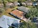 An elevated view displays the home within a community setting and manicured lawns at 123 Avenham Drive, Deland, FL 32724