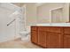 Bright bathroom featuring a tile floor, wooden vanity, and a white shower with glass door at 123 Avenham Drive, Deland, FL 32724