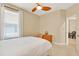 Bedroom featuring carpet, ceiling fan, natural light, and view into ensuite bath at 123 Avenham Drive, Deland, FL 32724