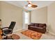 Bedroom featuring a ceiling fan, cozy couch, and a comfortable office chair at 123 Avenham Drive, Deland, FL 32724