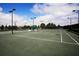 Well-maintained tennis court with lights, and a covered gazebo for players to rest between sets at 123 Avenham Drive, Deland, FL 32724