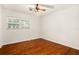 Bedroom with hardwood floors, ceiling fan and natural light from the window at 1307 Lindenwood Ln, Winter Park, FL 32792