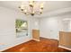 Elegant dining room with hardwood floors and classic chandelier at 1307 Lindenwood Ln, Winter Park, FL 32792