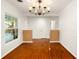 Dining area with gleaming hardwood floors, and natural light at 1307 Lindenwood Ln, Winter Park, FL 32792