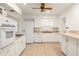 Bright kitchen with a tile floor and appliances; a practical design at 1307 Lindenwood Ln, Winter Park, FL 32792