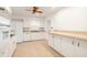 Clean kitchen with tile floor, white cabinetry, and ample counter space at 1307 Lindenwood Ln, Winter Park, FL 32792