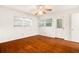 Living room with hardwood floors, neutral walls and natural light from windows and door at 1307 Lindenwood Ln, Winter Park, FL 32792