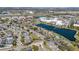 Aerial view of a community with a lake and mature trees at 13101 Summerton Dr, Orlando, FL 32824