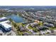 Aerial view of a community with a lake and mature trees at 13101 Summerton Dr, Orlando, FL 32824