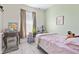 Cozy bedroom featuring a vanity, window and soothing colors at 13101 Summerton Dr, Orlando, FL 32824