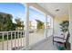 Spacious balcony featuring white columns and a view of the neighborhood at 1389 Chatfield Pl, Orlando, FL 32814