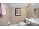 Cozy half bathroom with a modern sink and neutral color palette at 1389 Chatfield Pl, Orlando, FL 32814