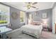 Gray bedroom with white trim, a ceiling fan, and a full size bed at 1389 Chatfield Pl, Orlando, FL 32814