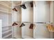 Organized walk-in closet with shelves and rods for ample storage at 1389 Chatfield Pl, Orlando, FL 32814