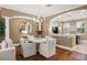 Dining area adjacent to kitchen, featuring hardwood floors and modern chandelier at 1389 Chatfield Pl, Orlando, FL 32814