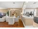 Spacious living and dining area flowing into a modern kitchen with white cabinets at 1389 Chatfield Pl, Orlando, FL 32814