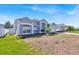 A spacious single-story house with a well-maintained lawn and a side yard with white fencing at 1409 Golf Course Pkwy, Davenport, FL 33837