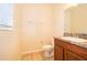 Bathroom featuring a vanity with granite counters, a sink, and a toilet at 14849 Driftwater Dr, Winter Garden, FL 34787