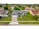 Overhead view of a well-kept home featuring verdant lawn and concrete driveway at 14923 Day Lily Ct, Orlando, FL 32824