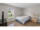 Simple bedroom with a window offering natural light at 14923 Day Lily Ct, Orlando, FL 32824