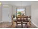 Cozy dining room featuring natural light and adjacent entrance at 14923 Day Lily Ct, Orlando, FL 32824