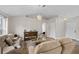 Cozy living room featuring neutral colors and tile flooring at 14923 Day Lily Ct, Orlando, FL 32824