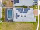 Birds eye view of the pool with a screened enclosure and solar panels at 2117 Trani Ter, St Cloud, FL 34771