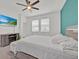 Bright bedroom with a modern bed, mounted TV, and serene atmosphere at 2117 Trani Ter, St Cloud, FL 34771