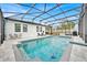 Outdoor pool with patio, screened enclosure, seating, and umbrellas at 2117 Trani Ter, St Cloud, FL 34771