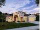 Lovely single-Gathering home with manicured lawn and neutral color palette at 2218 Elegant Maor Cir, Edgewater, FL 32141